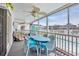 This relaxing screened in porch features comfortable seating and overlooks the community pool at 329 54Th Ave. N, North Myrtle Beach, SC 29582