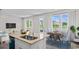 Open-concept living and dining area with waterfront views, natural light, and stylish decor at 3382 Wood Stork Dr., Ocean Isle Beach, SC 28469