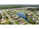 A high angle view of a neighborhood featuring a central pond with a fountain and well-maintained homes at 409 Cypress View Ave., Little River, SC 29566
