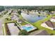 Aerial view of neighborhood amenities including a pool, a lake, and green spaces at 409 Cypress View Ave., Little River, SC 29566