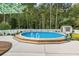Backyard features an above ground pool with a privacy fence at 409 Cypress View Ave., Little River, SC 29566