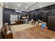 Large garage with custom storage, a mirror, and a projector at 409 Cypress View Ave., Little River, SC 29566
