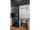 Laundry room boasting stacked washer/dryer and a convenient folding area at 409 Cypress View Ave., Little River, SC 29566