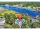 Aerial view of complex surrounded by lush greenery with waterway nearby, ideal for nature enthusiasts at 4400 Turtle Ln. # 2-D, Little River, SC 29566