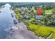 Great aerial view of waterfront property with docks, a golf course, and marshland at 4400 Turtle Ln. # 2-D, Little River, SC 29566