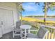 Inviting balcony featuring seating and picturesque waterfront scenery, perfect for relaxation at 4400 Turtle Ln. # 2-D, Little River, SC 29566