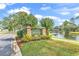 Charming entrance sign showcases a well-kept lawn and a tranquil pond at 4400 Turtle Ln. # 2-D, Little River, SC 29566