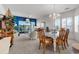Charming dining room and living room combo with access to the screened balcony at 4400 Turtle Ln. # 2-D, Little River, SC 29566
