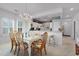 Open concept dining area with kitchen access and views of the outdoor scenery at 4400 Turtle Ln. # 2-D, Little River, SC 29566