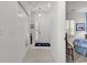 Inviting entrance area with front door, closet, nautical decor, and bedroom view at 4400 Turtle Ln. # 2-D, Little River, SC 29566