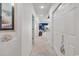 Bright hallway with neutral carpet, closet, and nautical decor accents at 4400 Turtle Ln. # 2-D, Little River, SC 29566
