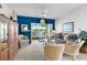Cozy living area with balcony, couch, nautical decorations, and carpet flooring at 4400 Turtle Ln. # 2-D, Little River, SC 29566