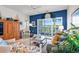 Relaxing living area with balcony access, nautical decor, and comfortable seating at 4400 Turtle Ln. # 2-D, Little River, SC 29566