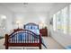 The main bedroom features shuttered windows, light carpet and ensuite bathroom access at 4400 Turtle Ln. # 2-D, Little River, SC 29566