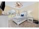 Comfortable bedroom with soft carpet, ceiling fan, and windows providing lots of light at 4683 Wild Iris Dr. # 103, Myrtle Beach, SC 29577