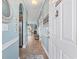 Inviting hallway with tile flooring leading to a living area at 4683 Wild Iris Dr. # 103, Myrtle Beach, SC 29577