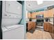 Well-lit kitchen with wooden cabinets and stainless steel appliances at 4683 Wild Iris Dr. # 103, Myrtle Beach, SC 29577
