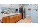 Bright kitchen featuring stainless steel appliances, light countertops, and hardwood cabinets at 4683 Wild Iris Dr. # 103, Myrtle Beach, SC 29577