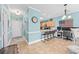 Inviting living space with tile flooring leading to a seating and kitchen area at 4683 Wild Iris Dr. # 103, Myrtle Beach, SC 29577