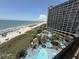 Capture the allure of this real estate gem from an aerial perspective, highlighting a sparkling pool at 4800 S Ocean Blvd. # 706, North Myrtle Beach, SC 29582