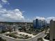 Aerial view of a condo building and houses reveals neighborhood layout, parking, nearby roads, and a glimpse of the surrounding landscape at 4800 S Ocean Blvd. # 706, North Myrtle Beach, SC 29582