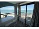 Balcony view with a dining table overlooking the ocean at 4800 S Ocean Blvd. # 706, North Myrtle Beach, SC 29582