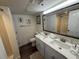 Bright bathroom with a double sink vanity and decorative seashell accents at 4800 S Ocean Blvd. # 706, North Myrtle Beach, SC 29582