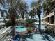 Beautiful resort pool area featuring palm trees and several different pool options and access points at 4800 S Ocean Blvd. # 706, North Myrtle Beach, SC 29582