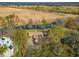 Aerial view of a single-story home surrounded by lush greenery and a tranquil waterway at 52 Trimmings Ct., Pawleys Island, SC 29585