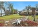 A serene backyard featuring a well-maintained lawn and comfortable seating near a river at 52 Trimmings Ct., Pawleys Island, SC 29585