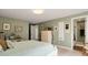 Comfortable bedroom featuring neutral decor, ensuite bathroom access, and plenty of natural light at 52 Trimmings Ct., Pawleys Island, SC 29585