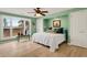 Charming bedroom with large window view, complemented by a light color scheme and wood flooring at 52 Trimmings Ct., Pawleys Island, SC 29585