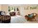 Light-filled bedroom with large window, wicker furniture, and serene decor at 52 Trimmings Ct., Pawleys Island, SC 29585