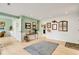 Charming entryway with green accent wall and brick feature, plus stylish decor and light wood flooring at 52 Trimmings Ct., Pawleys Island, SC 29585