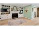 Inviting living room with a fireplace and built-in shelving at 52 Trimmings Ct., Pawleys Island, SC 29585
