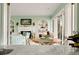 Open-concept room with fireplace, built-in shelving, and large windows offering scenic views at 52 Trimmings Ct., Pawleys Island, SC 29585