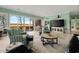 Comfortable living room with large windows offering views of the scenic yard at 52 Trimmings Ct., Pawleys Island, SC 29585