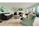 Bright and inviting living room with fireplace, built-in shelves, and waterfront views at 52 Trimmings Ct., Pawleys Island, SC 29585