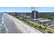 Stunning aerial perspective highlighting oceanfront condos, sandy beach, and blue ocean at 5523 N Ocean Blvd. # 1412, Myrtle Beach, SC 29577