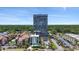 An aerial view displays a high-rise building with surrounding landscaping and a community pool at 5523 N Ocean Blvd. # 1412, Myrtle Beach, SC 29577