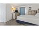 Well-lit bedroom features a comfortable queen-sized bed and plenty of storage at 5523 N Ocean Blvd. # 1412, Myrtle Beach, SC 29577