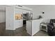 A modern kitchen features white cabinets, granite countertops, and stainless steel appliances at 5523 N Ocean Blvd. # 1412, Myrtle Beach, SC 29577