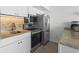 The kitchen boasts stainless steel appliances, granite countertops, and bright lighting at 5523 N Ocean Blvd. # 1412, Myrtle Beach, SC 29577