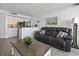 Comfortable living room features a leather sofa and is adjacent to the modern kitchen at 5523 N Ocean Blvd. # 1412, Myrtle Beach, SC 29577