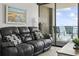 Relax in the living room with sliding glass door to balcony with seating at 5523 N Ocean Blvd. # 1412, Myrtle Beach, SC 29577