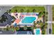 Aerial shot of a refreshing pool area with lounge chairs, umbrellas, and tropical landscaping at 5523 N Ocean Blvd. # 1412, Myrtle Beach, SC 29577