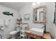 Charming bathroom with beadboard walls, unique seashell mirror, and stylish fixtures at 6001 - 1040 S Kings Hwy., Myrtle Beach, SC 29575