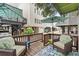 Outdoor living space featuring wicker chairs, a wooden deck, and views of surrounding homes at 6001 - 1040 S Kings Hwy., Myrtle Beach, SC 29575