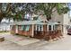 Charming exterior with wood siding, turquoise shutters and a spacious wood deck with blue umbrellas at 6001 - 1040 S Kings Hwy., Myrtle Beach, SC 29575