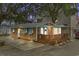 Charming exterior with wood siding, turquoise shutters and a spacious wood deck with blue umbrellas at 6001 - 1040 S Kings Hwy., Myrtle Beach, SC 29575